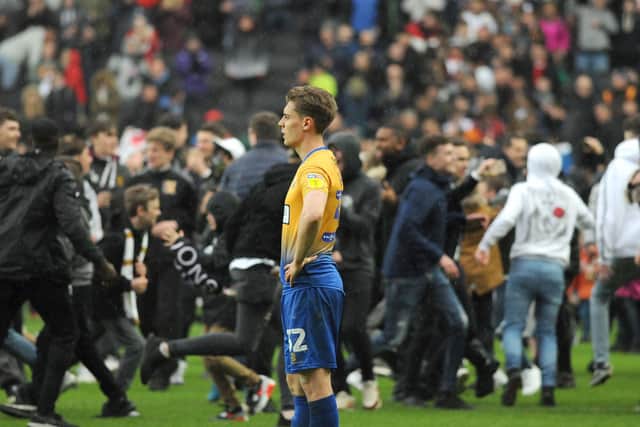 MK Dons v Mansfield Town - Danny Rose is isolated amid a sea of MK Dons fans at the final whistle.