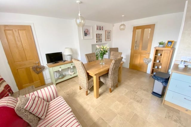 This is the pleasant dining space that is part of the open-plan kitchen/diner. The attractive flooring is Karndean.