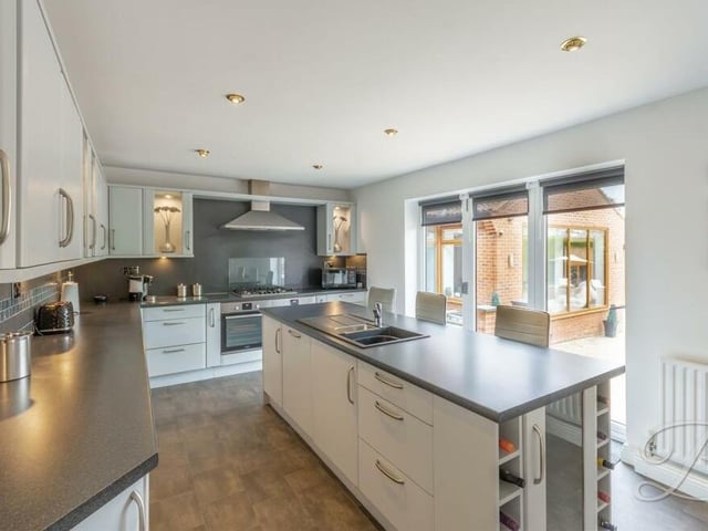 And so to the impressive kitchen at the £750,000 Huthwaite bungalow. It comes complete with an excellent range of modern wall and base units, an integrated oven, gas hob with stainless steel extractor fan above and breakfast bar. There is also an island with inset sink and drainer, integrated dishwasher and wine fridge, not to mention bi-folding doors leading to the back garden.