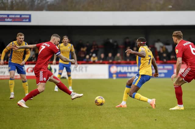 Lucas Akins challenges during the Sky Bet League 2 match against Crawley Town FC at The Broadfield Stadium, Saturday 16 December2023 
Photo credit -  Chris & Jeanette Holloway / The Bigger Picture.media