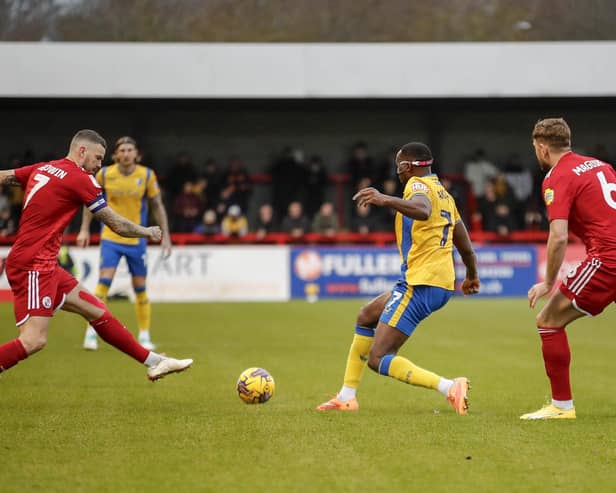 Lucas Akins challenges during the Sky Bet League 2 match against Crawley Town FC at The Broadfield Stadium, Saturday 16 December2023 
Photo credit -  Chris & Jeanette Holloway / The Bigger Picture.media