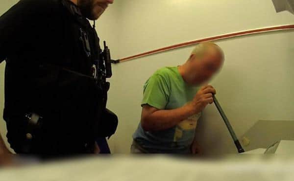 Drink driver suspect with Nottinghamshire Police officers.