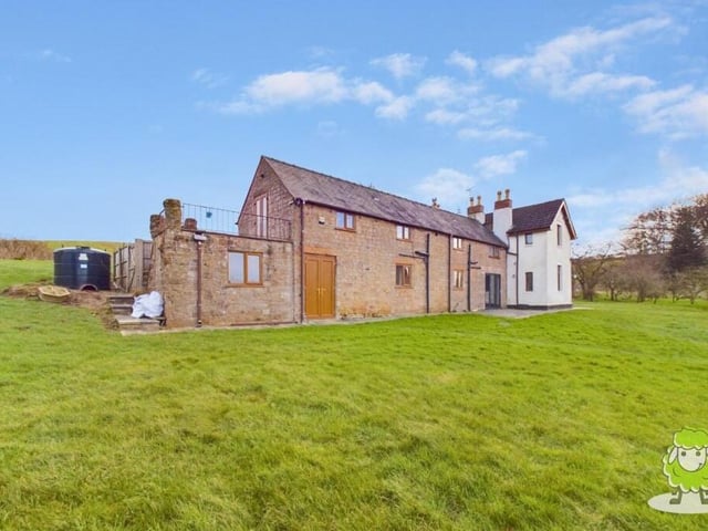 An alternative view of the property from the rear and side. The farmhouse could appeal to families with equestrian interests because there is plenty of scope to build stables.