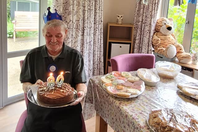 Ian Way with his cake at his 80th birthday party.