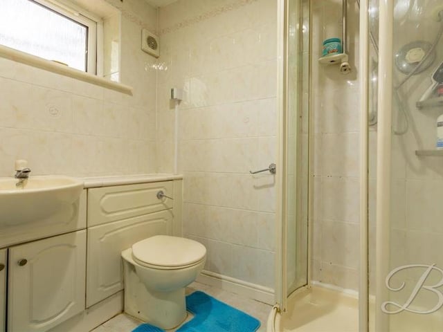The annexe has its own en suite bathroom, which includes an enclosed shower, wash hand basin, low-flush WC, full-height tiling and extractor fan.