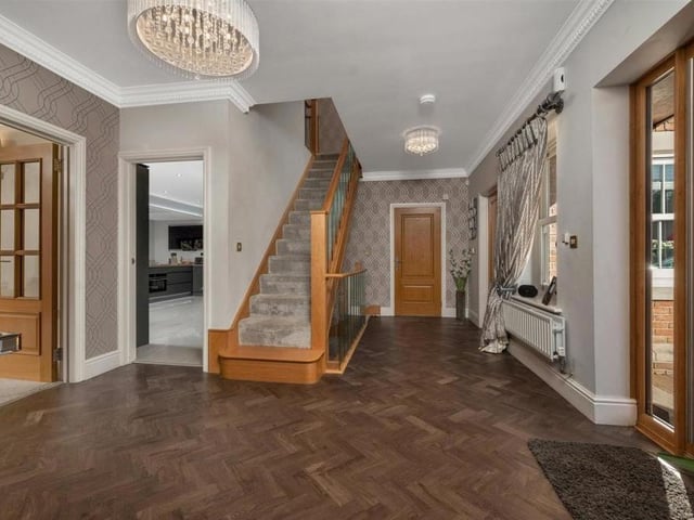 As you go into the Croft Avenue house, you are greeted by this L-shaped entrance hall, with its Karndean floor, coving to the ceiling and staircase up to the galleried first-floor landing. Doors lead to the dining room, lounge and kitchen.