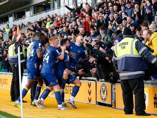 Stags celebrate going ahead at Newport County with the away fans.
