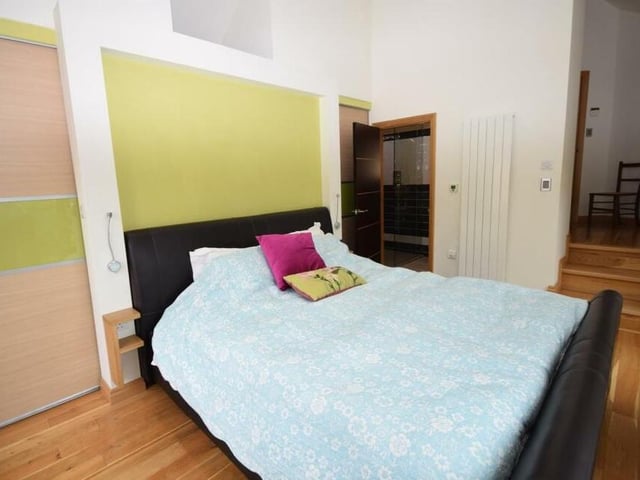 As you can see, the main bedroom has access to an en suite shower room, which is beautifully finished. It consists of a walk-in double shower, low-flush WC, wash basin, tiled walls and floor and a chrome heated towel-radiator..