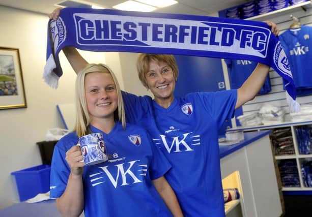 Staff at the new club shop get ready to welcome customers.