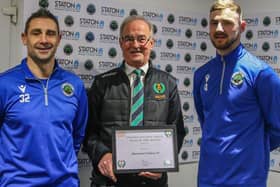 UCL chairman Alan Poulain (centre) presents the Premier Division North Team of the Month award to coach Chris Timons (left) and club captain Jobe Shaw. Photo by Dave Porter.