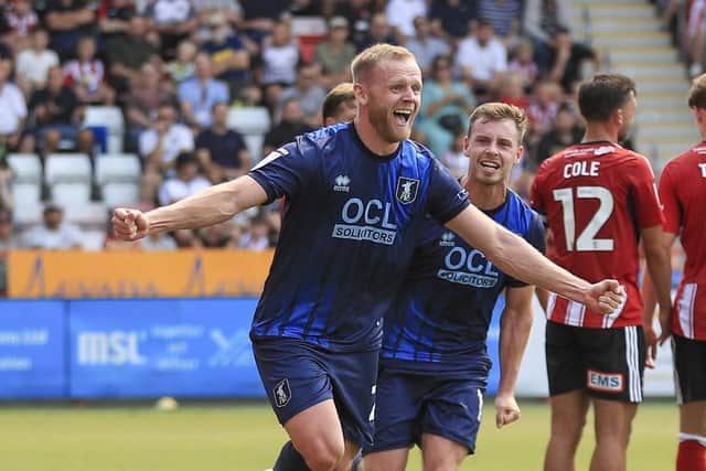 Mansfield Town defender Frazer Blake-Tracy (20) celebrates his first half goal during the Sky Bet League 1 match against Exeter City FC at St James Park, 16 Aug 2025   Photo credit : Chris & Jeanette Holloway / The Bigger Picture.media