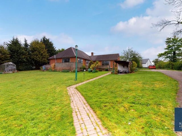 Wonderful mature gardens, with large lawns, can be found at the front, side and back of the property. Here a charming pathway leads towards an open-fronted former stable.