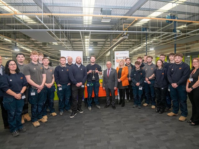 AF Switchgear’s current apprentice of the year Elliot Allen with the trophy, with the company’s staff and fellow apprentices