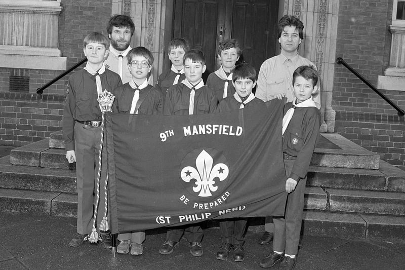 Members of Mansfield 9th Scouts show off a new flag in 1990.