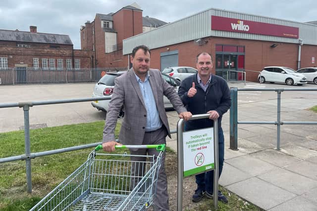 Councillors Jason Zadrozny and David Hennigan test the technology at Asda in Sutton