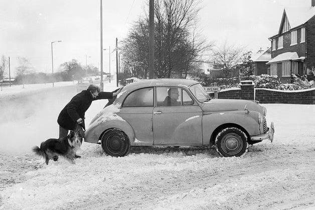 A friend helping a motorist get moving in the snow in Mansfield Woodhouse back in 1968.