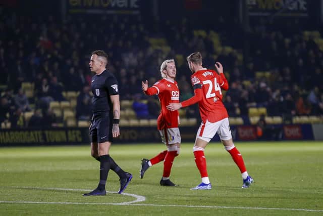 Lewis Brunt celebrates his early opener with Aaron Lewis during the Sky Bet League 2 match against Harrogate Town AFC at The EnviroVent Stadium, 24 Oct 2023  
Photo credit : Chris & Jeanette Holloway / The Bigger Picture.media