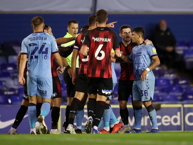 Gustavo Hamer of Coventry City (right) interacts with players before being shown the red card against Bournemouth.