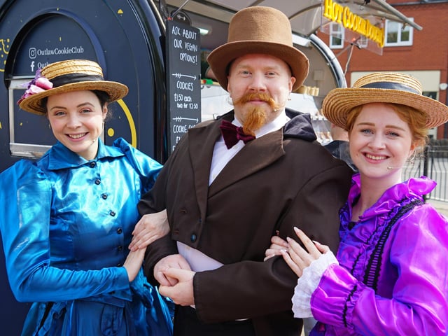 Members of the Past times show walking around the market in period dress from when it all began.