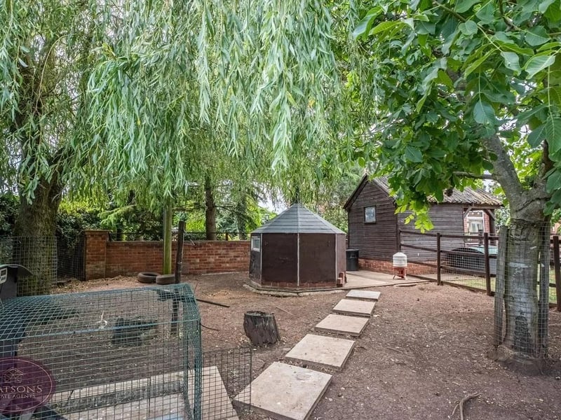 The garden boasts dusk till dawn lighting, security lighting, raised wooden planter with a range of plants & shrubs, a fruit orchard, mature trees including chestnut, fig and walnut and farm gates on each of the 3 entrances. The land is enclosed by hedge and wall with decorative wrought iron to the perimeter.