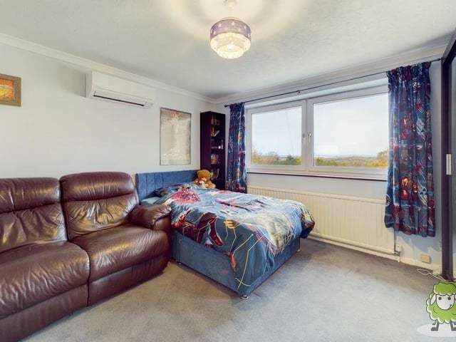 The second bedroom, which faces the front if the house, is big enough to have space for comfortable furniture.