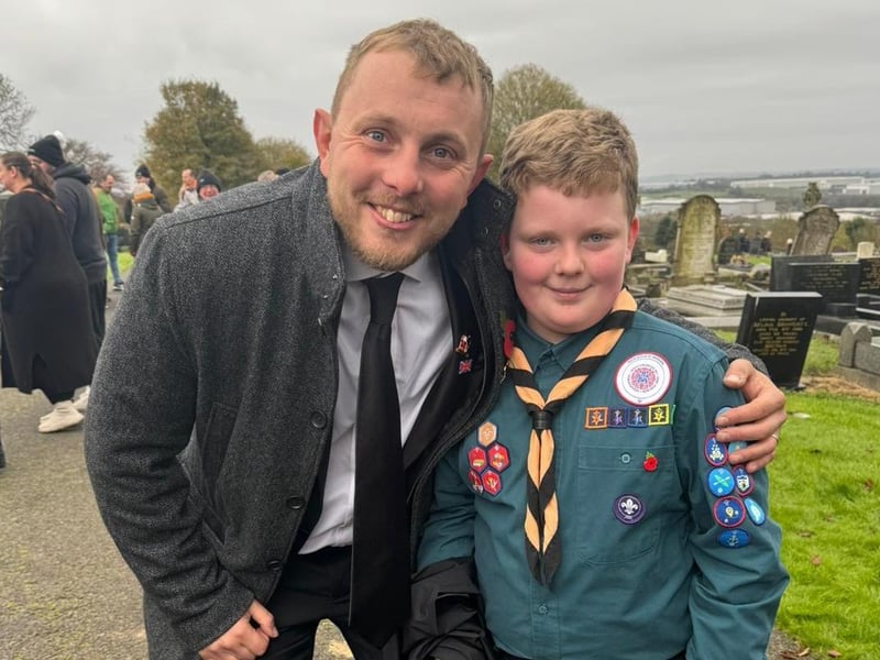 Coun Tom Hollis with a young scout at the Huthwaite Remembrance parade