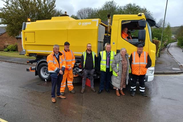Pictured are Council and Scarab officials with the new street sweeping vehicle