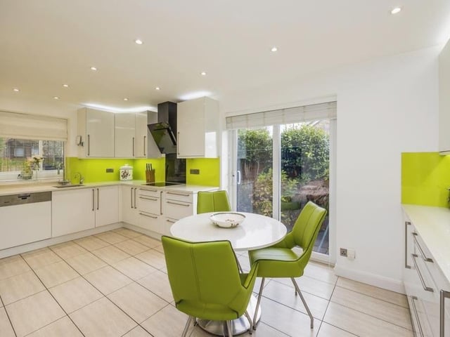 Let's start our tour of the Longdale Avenue bungalow in the kitchen/breakfast room. If it looks sparkling, that's because it has been recently refurbished, complete with white gloss units and ceiling spotlights. Double-glazed doors lead out to the garden.
