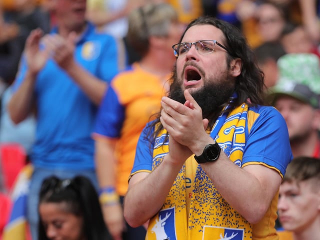 Mansfield Town fans watch the drama unfold inside Wembley