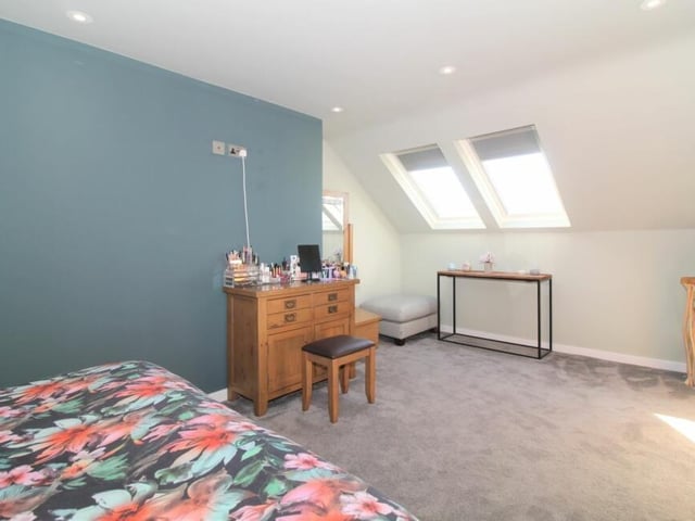 This bedroom at the £1.1 million property sits on the second floor, complete with two Velux windows.