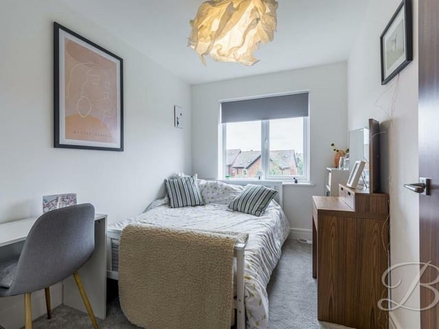 The fifth and final bedroom, which faces the back of the house, is the smallest but there is still space for a desk and other furniture.