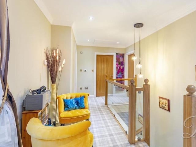 At the top of the stairs, you are greeted by this lovely landing. It has a carpeted floor, downlights and a window facing the front of the property