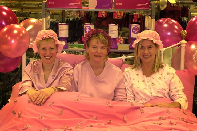Marks and Spencer lingerie staff spent the day in bed at work in aid of breakthrough breast cancer in 2002. Left to right, Helen Challinor, Amanda Letchford and Sally Robinson in bed at the store in Meadowhall