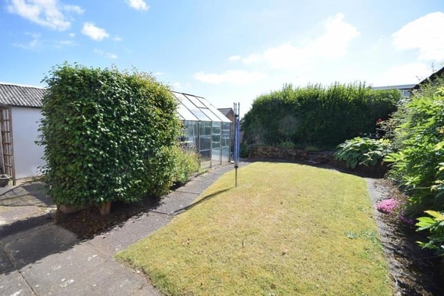 Another shot of the back garden, which offers a high level of privacy, with its hedges and shrubbery borders, plus a securely fenced, enclosed boundary.