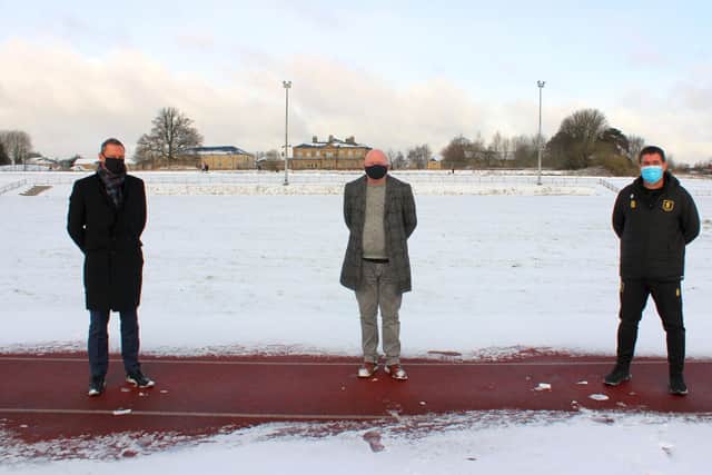 From left are Radford Foundation trustee Nik Springthorpe, Mansfield Harriers chairman Pat Carlan and Mansfield Town manager Nigel Clough at Berry Hill athletics track.