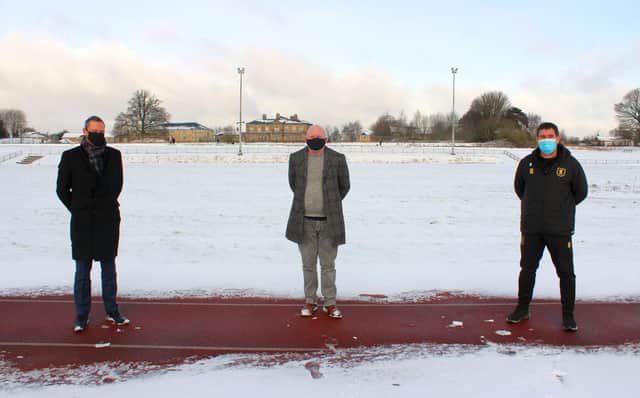 From left are Radford Foundation trustee Nik Springthorpe, Mansfield Harriers chairman Pat Carlan and Mansfield Town manager Nigel Clough at Berry Hill athletics track.
