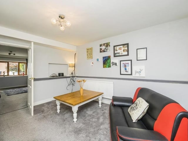 Next to the lounge is this sitting room or dining room. It has a door (not shown) that accesses the internal garage.