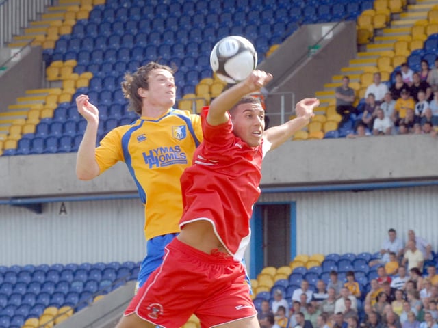 Scott Gardner goes up for a header.