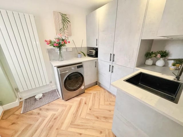 A separate utility room adds to the functionality.