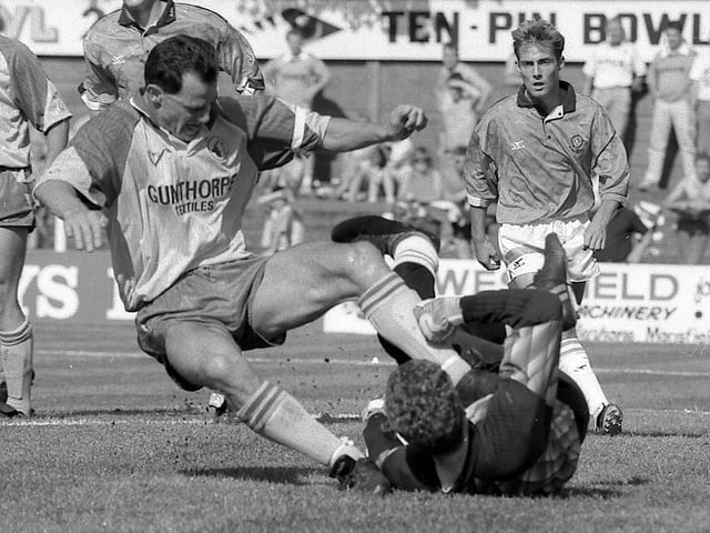 Steve Charles gets stuck in against Blackpool.