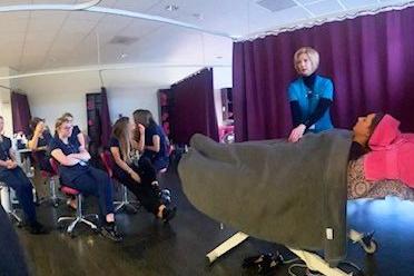 The healing art of reiki was demonstrated by Rebecca Howarth to beauty students