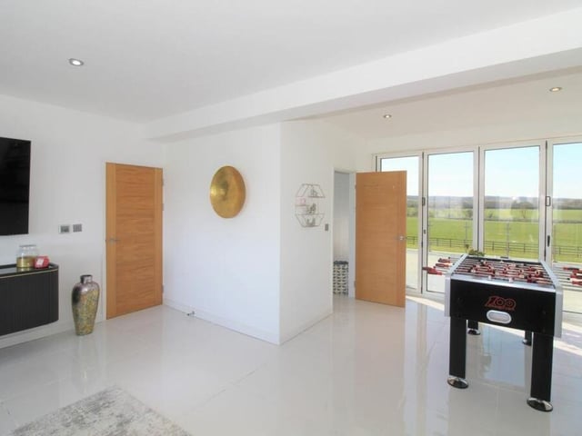 We've moved upstairs now to the first floor, where the main bedroom can also be used as a living room. It has a balcony and an en suite.