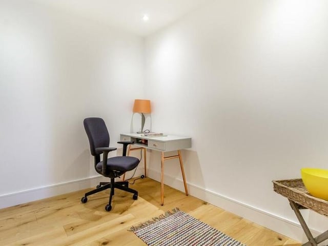 A useful bonus on the ground floor of the £625,000 stone barn conversion is this office. It has an engineered oak floor, underfloor heating and four ceiling spotlights.
