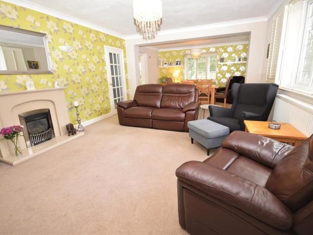 The first room we take a look at is this large lounge, which has all the space you need for the family and guests. A living-flame gas fire, with feature surround, creates a homely feel, while the smart decor is complemented by coving to the ceiling.