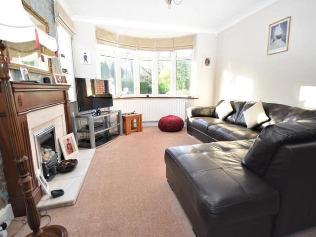 The first main reception room you come to at the £895,000 property is this elegant lounge, Large and offering lots of layout options, it has a feature fireplace and lets in lots of natural light, courtesy of a bay window at the front of the house and a secondary window at the side.