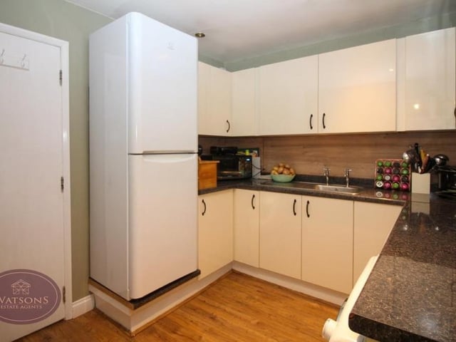 The utility room is a terrific addition to the kitchen, with its wood-effect laminate flooring and ceiling spotlights. It includes a range of matching wall and base units, and work surfaces incorporating a stainless steel sink and drainer, plus plumbing for a washing machine and dryer.