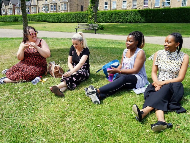 Friends enjoying the sun in Titchfield Park.