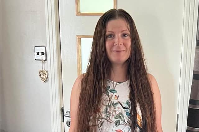 Hazel with her 40-inch locks before it was cut for charity.