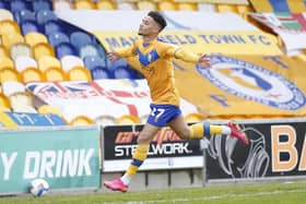 Tyrese Sinclair celebrates after he scores for Stags against Oldham Athletic last May.