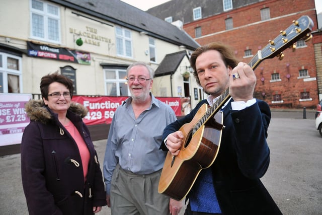 Janice Forbes from Hartlepool and District Hospice is pictured with David Mountney (standing) landlord of The Blacksmiths Arms along with Karl Moppett from Blues is Black. This is  reminder of a charity night at the pub in aid of the hospice in 2014. Remember it?